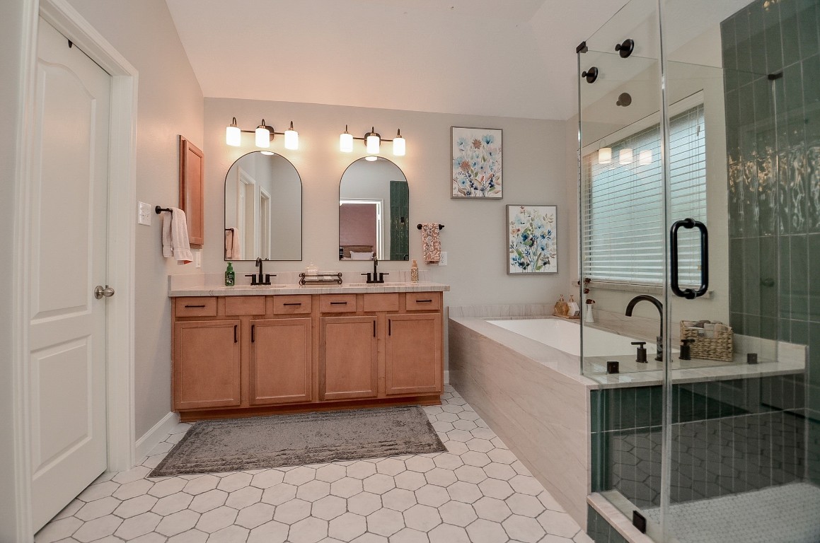 9222 Sorrell Hollow Lane Rosenberg, TX 77469 - Photo 32 of 46 Thoughtfully designed and recently updated primary bathroom with generous space, dual vanities, and a clean, modern aesthetic throughout.