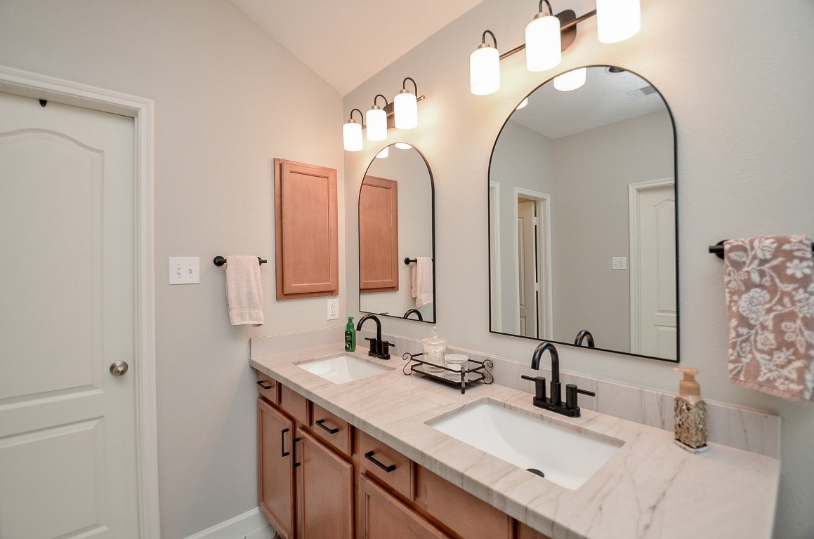 9222 Sorrell Hollow Lane Rosenberg, TX 77469 - Photo 33 of 46 Dual sink vanity with updated lighting, sleek fixtures, and ample counter space for everyday convenience.