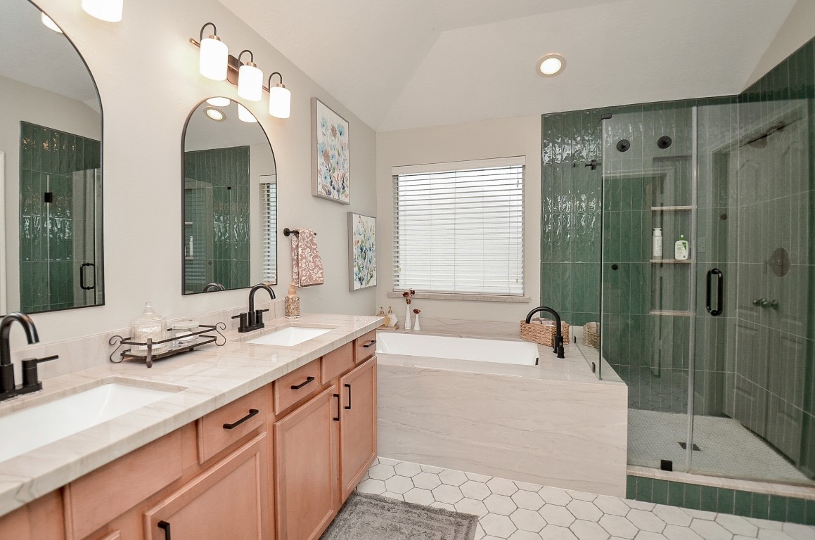 9222 Sorrell Hollow Lane Rosenberg, TX 77469 - Photo 36 of 46 Beautifully updated primary bathroom featuring dual sinks, modern finishes, and a relaxing soaking tub.