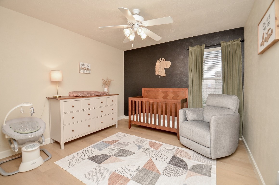 9222 Sorrell Hollow Lane Rosenberg, TX 77469 - Photo 37 of 46 Cozy secondary bedroom with a warm accent wall, ideal as a nursery, guest room, or creative space.