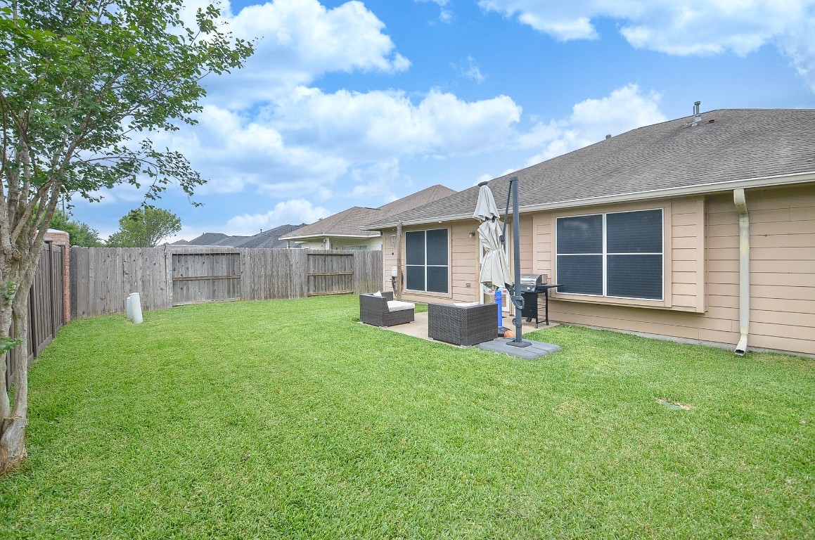 9222 Sorrell Hollow Lane Rosenberg, TX 77469 - Photo 45 of 46 Expansive backyard with ample room to play or entertain, complete with a patio space and a 10x12 shed added in 2025.