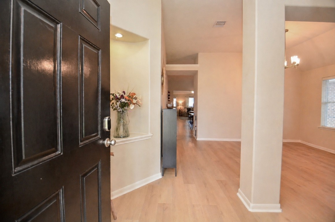 9222 Sorrell Hollow Lane Rosenberg, TX 77469 - Photo 6 of 46 Welcoming entry opens to a spacious layout with updated LVP flooring (2025) and a versatile front area. *This image has been virtually staged
