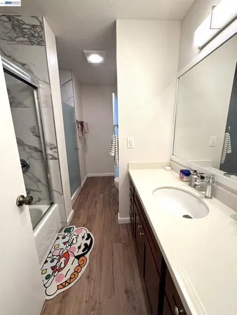a bathroom with a sink a vanity and mirror