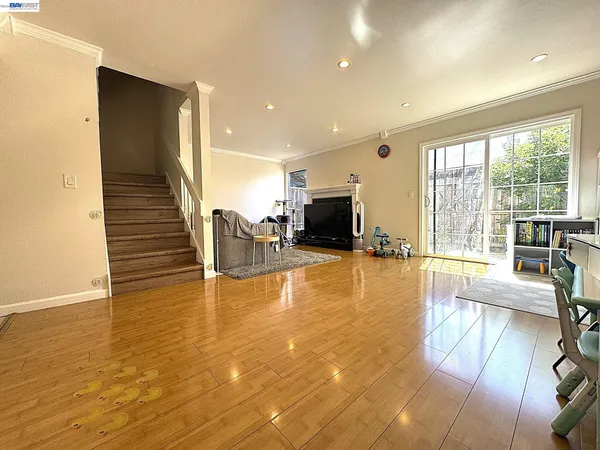 a view of kitchen and dining room with furniture wooden floor and windows