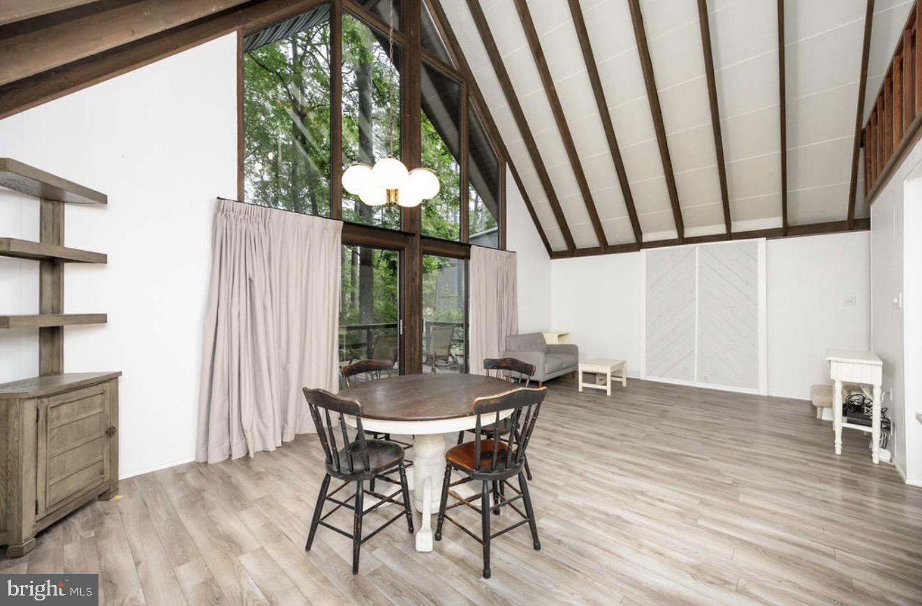 5 Falcon Bridge Road Ocean Pines, MD 21811 - Photo 9 of 59 a dining room with furniture window wooden floor