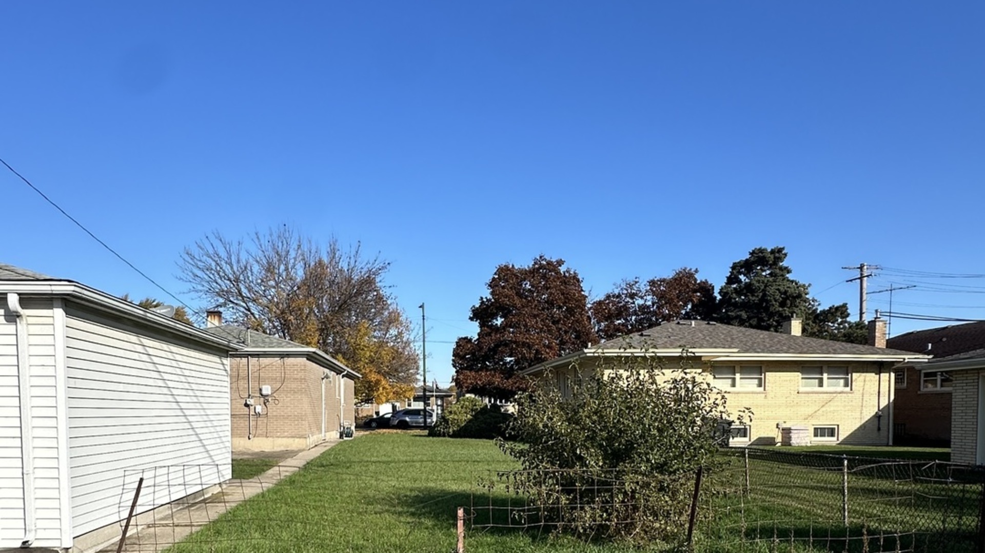 2917 East 130th Street Chicago, IL 60633 - Photo 2 of 3 a front view of a house with a yard