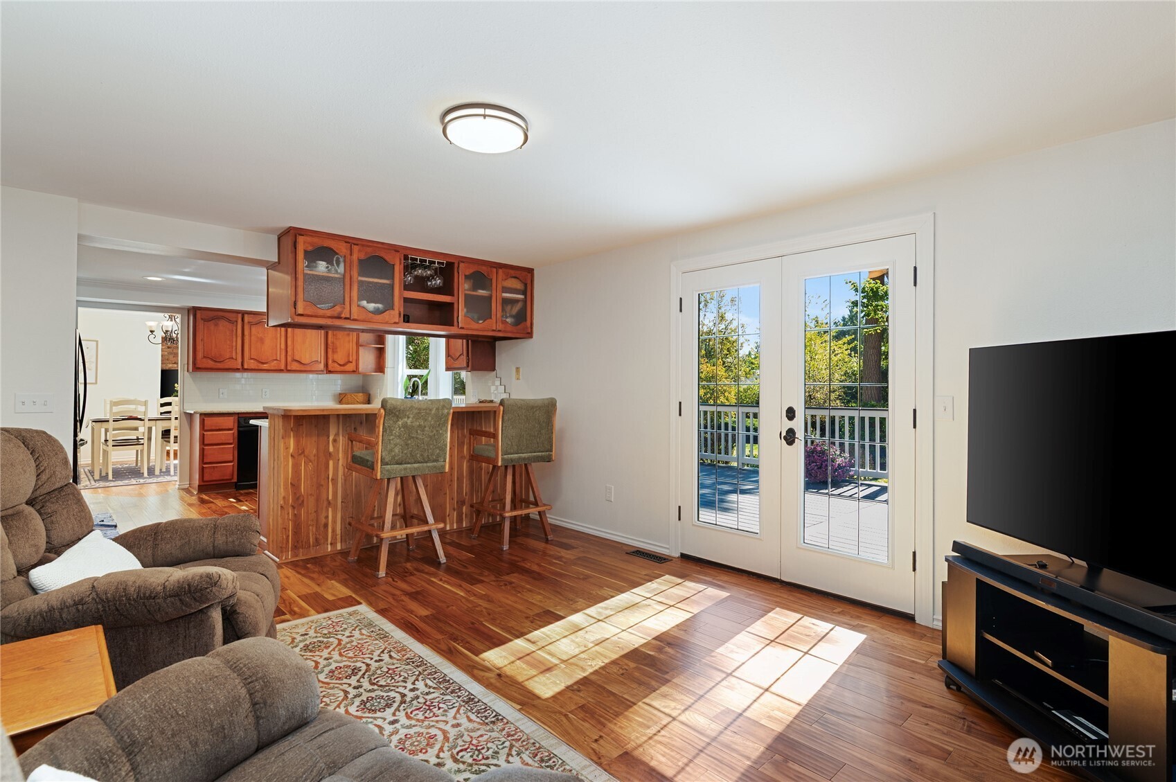 4293 Northwest Westgate Road Silverdale, WA 98383 - Photo 11 of 37 a living room with furniture and a flat screen tv