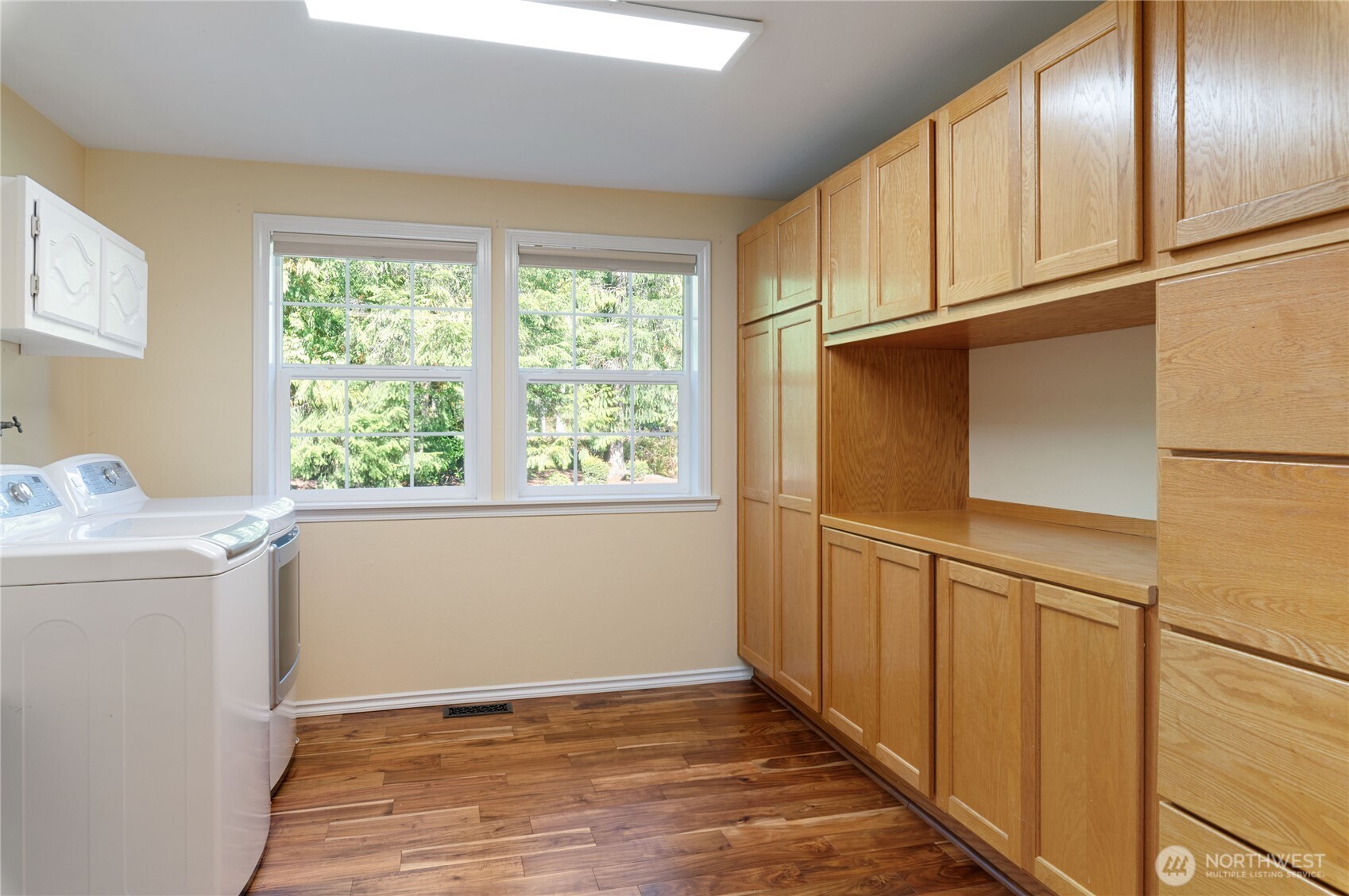 4293 Northwest Westgate Road Silverdale, WA 98383 - Photo 12 of 37 a view of empty room with wooden floor and window
