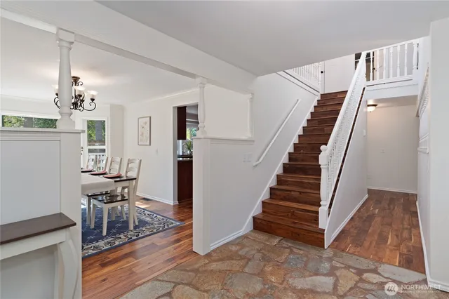 a view of dining room with furniture and wooden floor