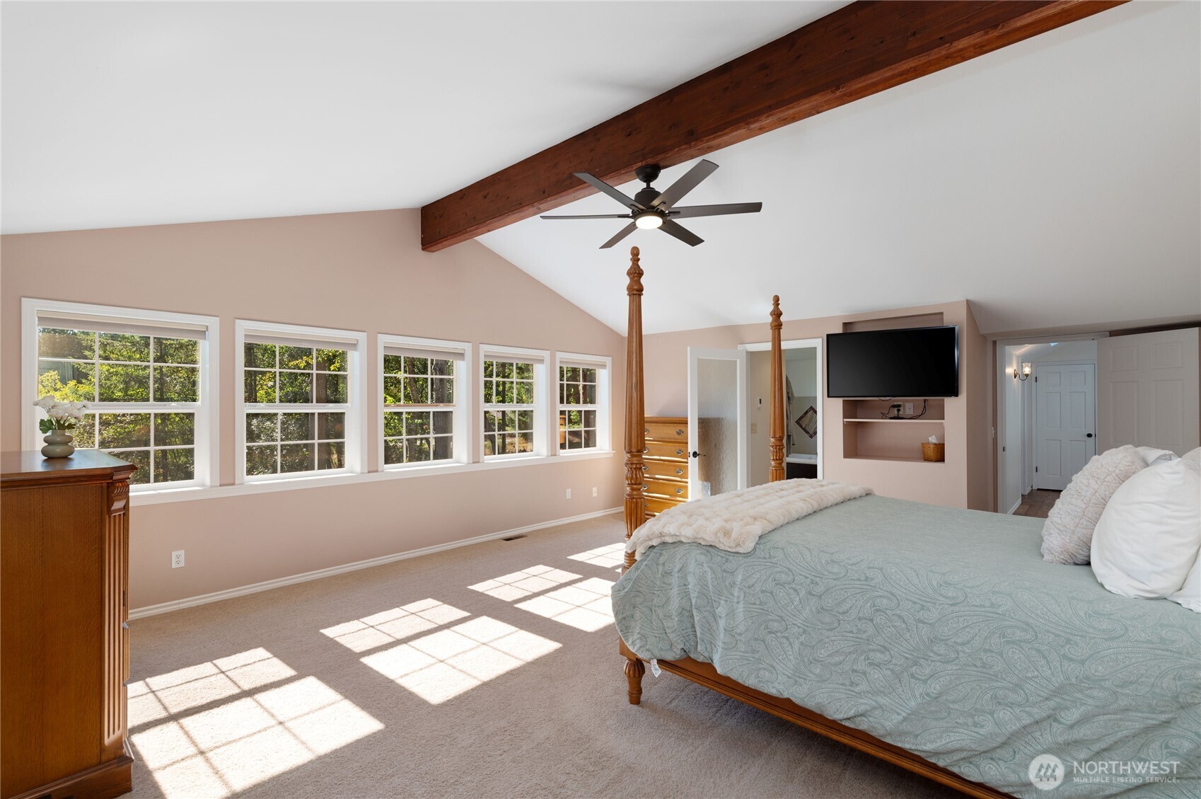 4293 Northwest Westgate Road Silverdale, WA 98383 - Photo 24 of 37 a bedroom with a large bed and a large window