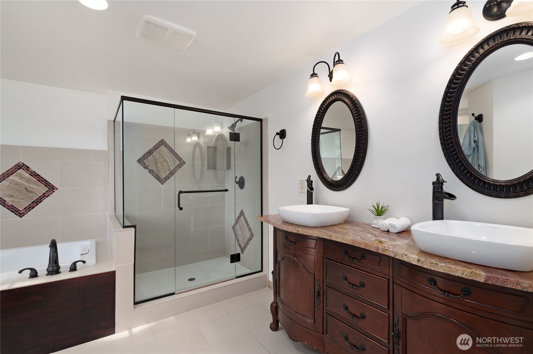 4293 Northwest Westgate Road Silverdale, WA 98383 - Photo 25 of 37 a bathroom with a granite countertop double vanity sink and a mirror