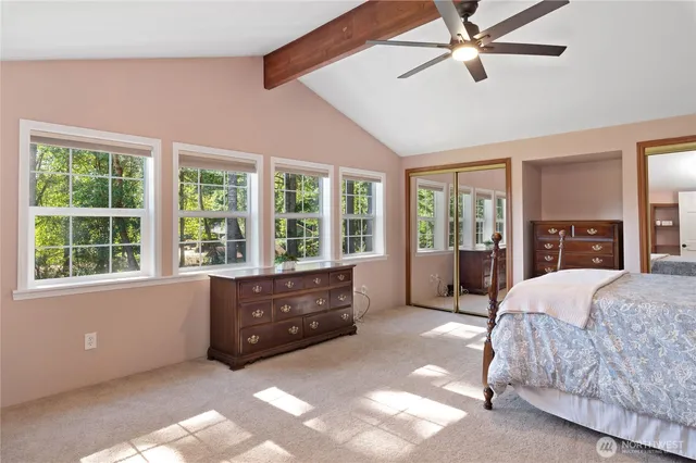 a bed room with a bed and a window