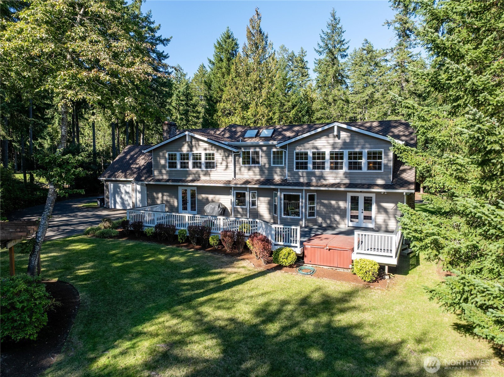 4293 Northwest Westgate Road Silverdale, WA 98383 - Photo 35 of 37 an aerial view of a house with swimming pool and garden