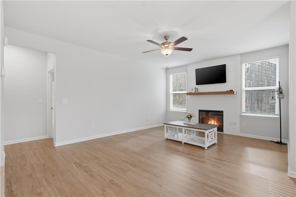 15 Parkside View Cartersville, GA 30121 - Photo 18 of 49 a living room with furniture a fireplace and a flat screen tv