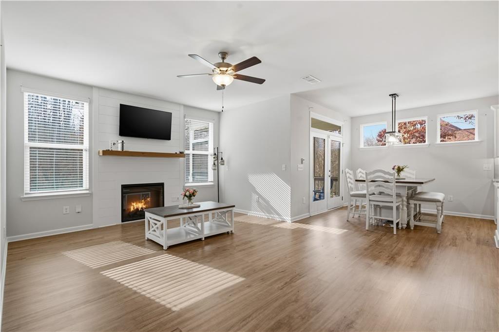 15 Parkside View Cartersville, GA 30121 - Photo 19 of 49 a living room with furniture a fireplace and a flat screen tv