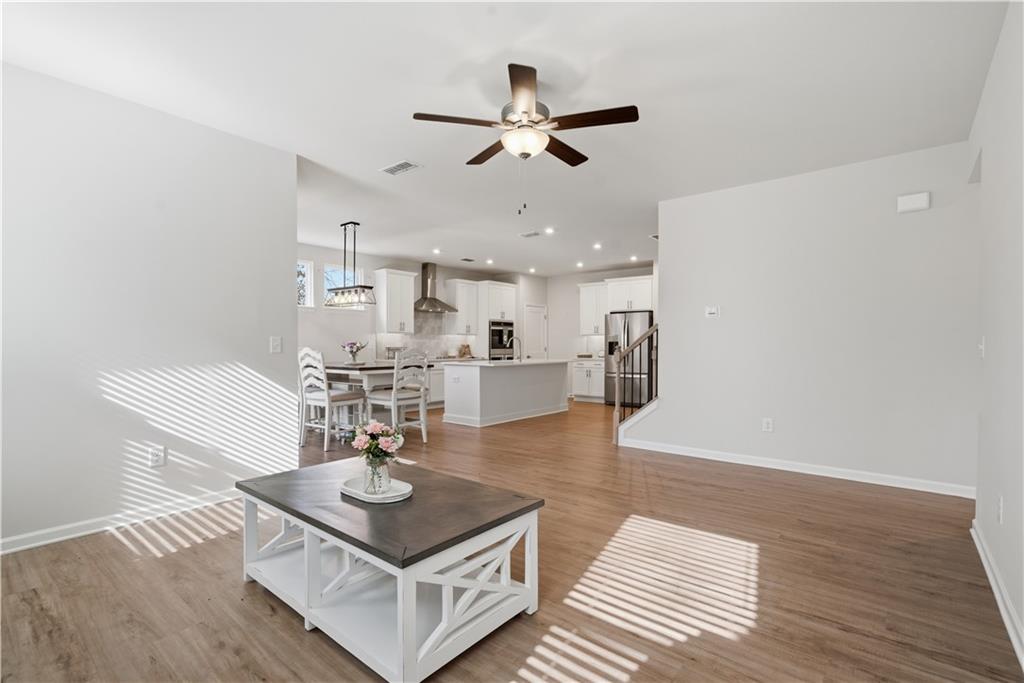 15 Parkside View Cartersville, GA 30121 - Photo 20 of 49 a living room with furniture and a wooden floor