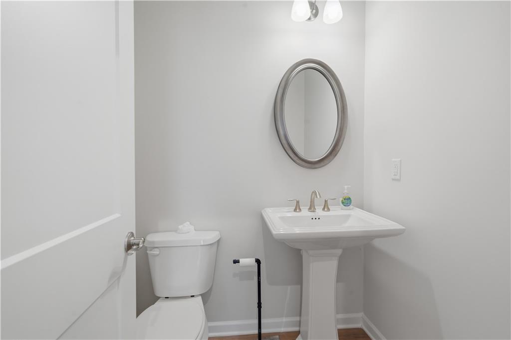 15 Parkside View Cartersville, GA 30121 - Photo 21 of 49 a bathroom with a sink a mirror and a toilet