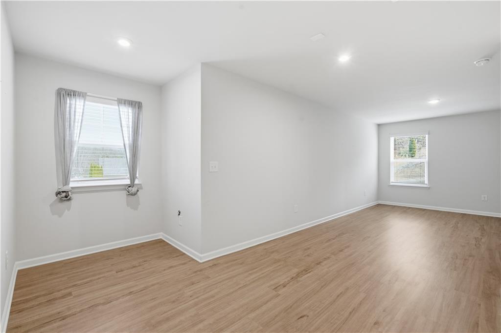 15 Parkside View Cartersville, GA 30121 - Photo 30 of 49 an empty room with wooden floor and windows
