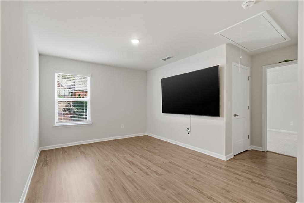 15 Parkside View Cartersville, GA 30121 - Photo 31 of 49 a view of a livingroom with wooden floor and white walls