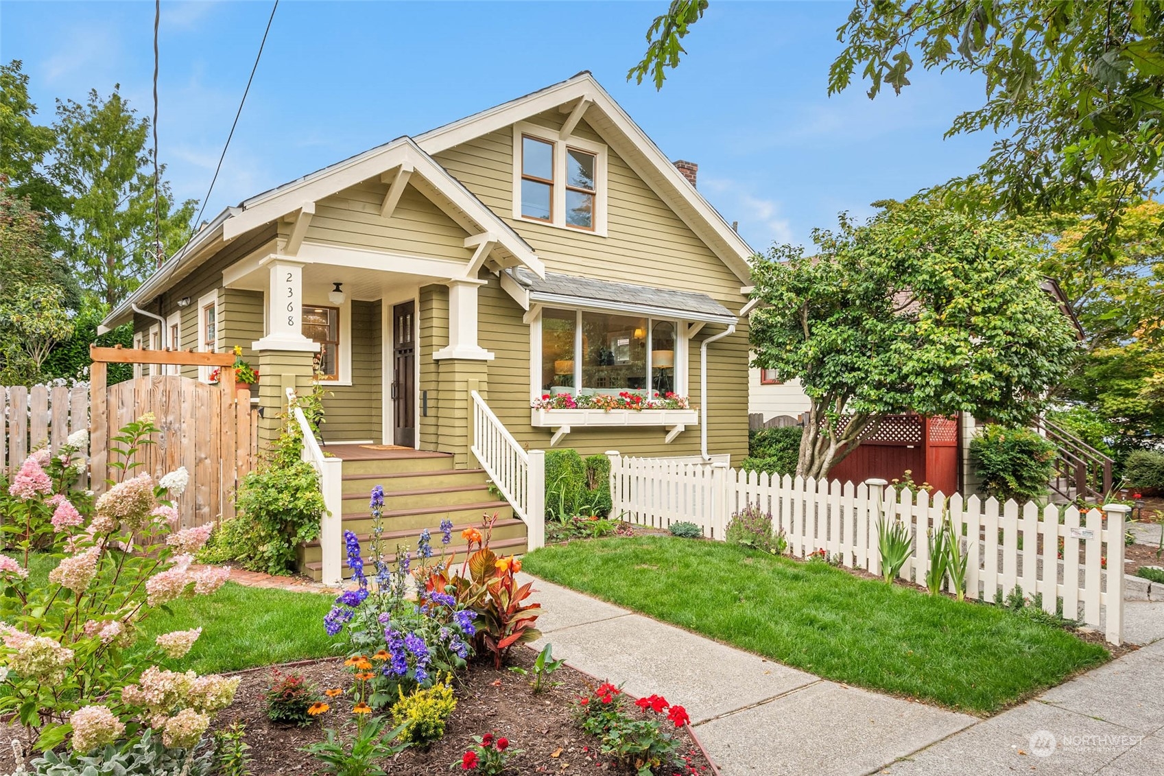 2368 North 52nd Street Seattle, WA 98103 - Photo 1 of 32 a front view of a house with a garden
