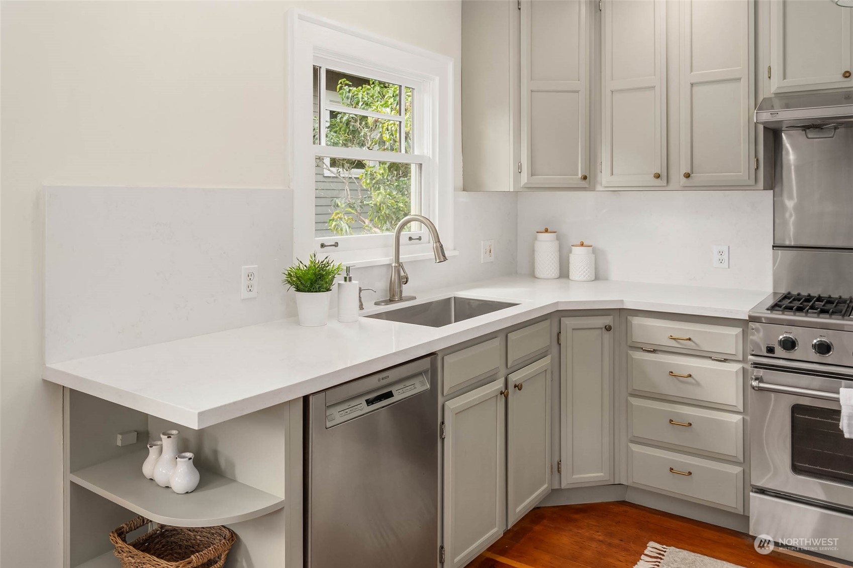 2368 North 52nd Street Seattle, WA 98103 - Photo 12 of 32 a kitchen with a sink cabinets and window