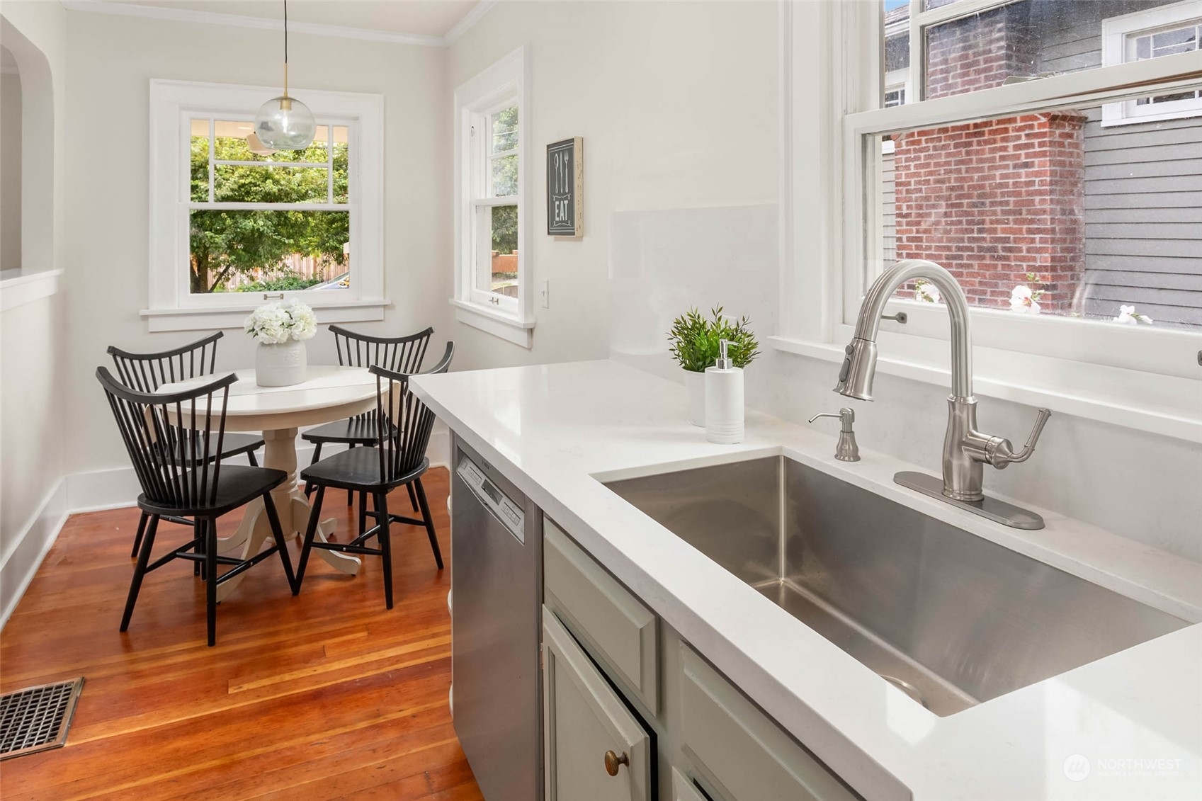 2368 North 52nd Street Seattle, WA 98103 - Photo 14 of 32 a kitchen with a table chairs and a window