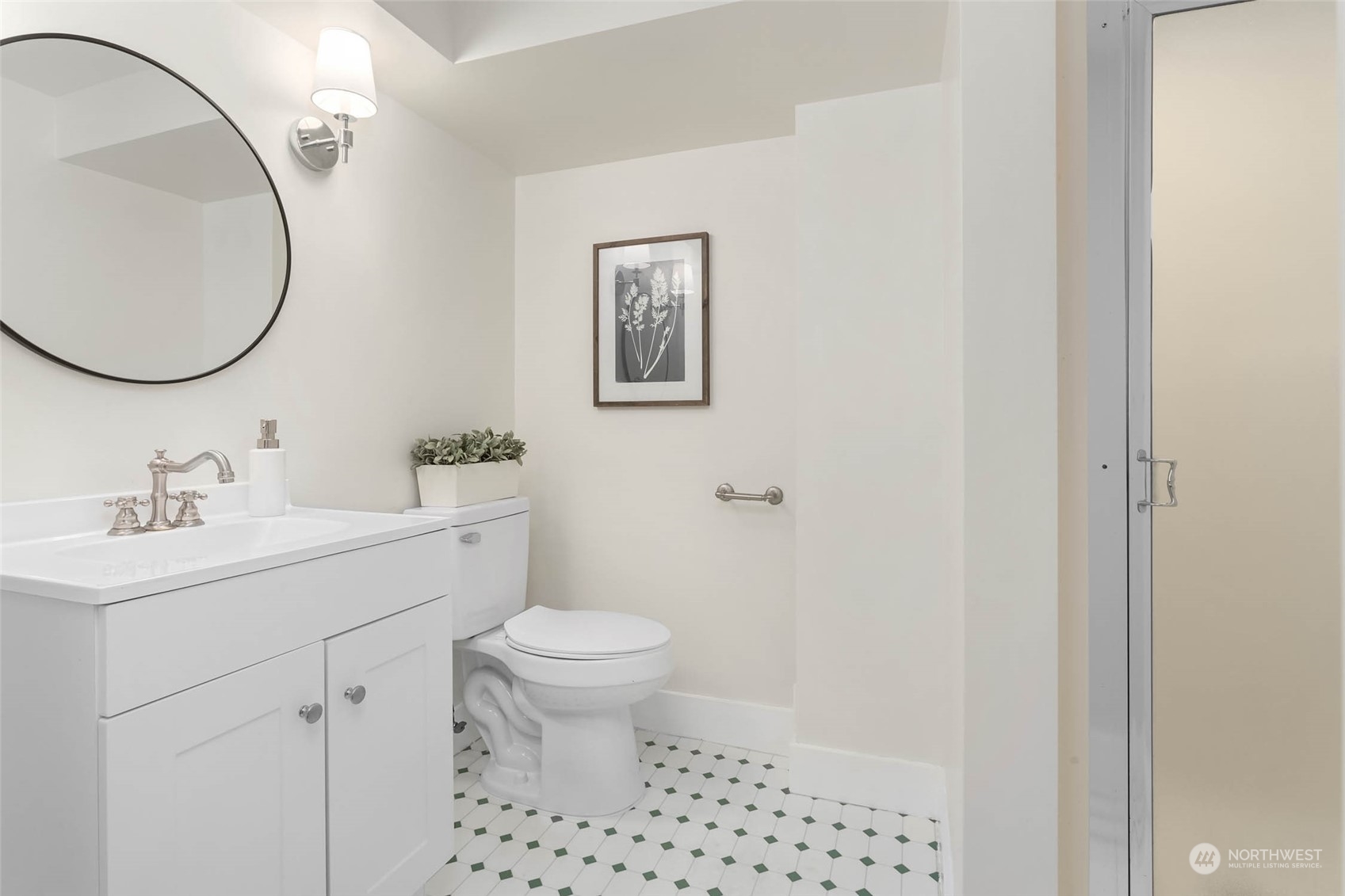 2368 North 52nd Street Seattle, WA 98103 - Photo 23 of 32 a bathroom with a sink a toilet and a mirror