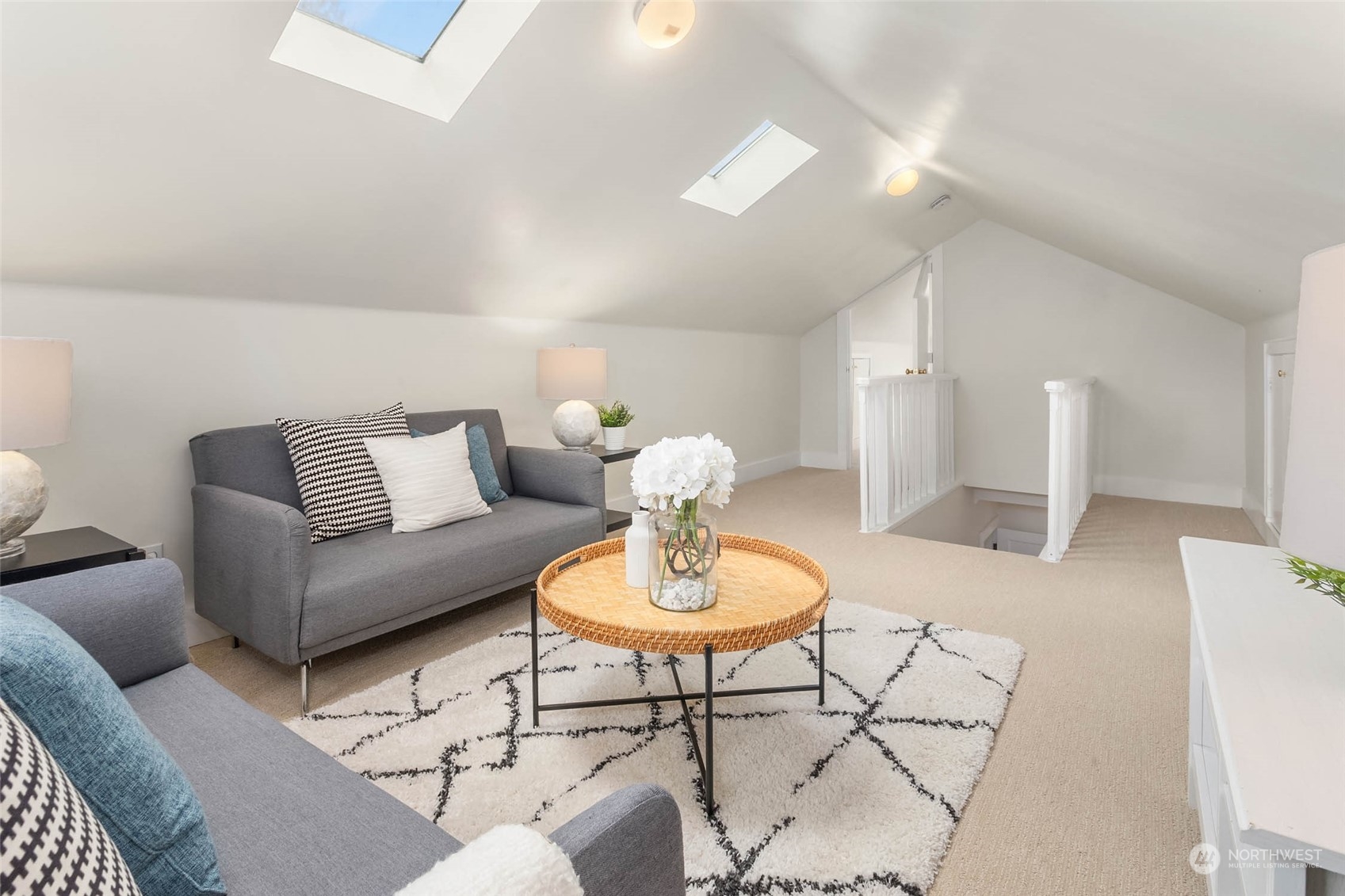 2368 North 52nd Street Seattle, WA 98103 - Photo 26 of 32 a living room with furniture and a chandelier