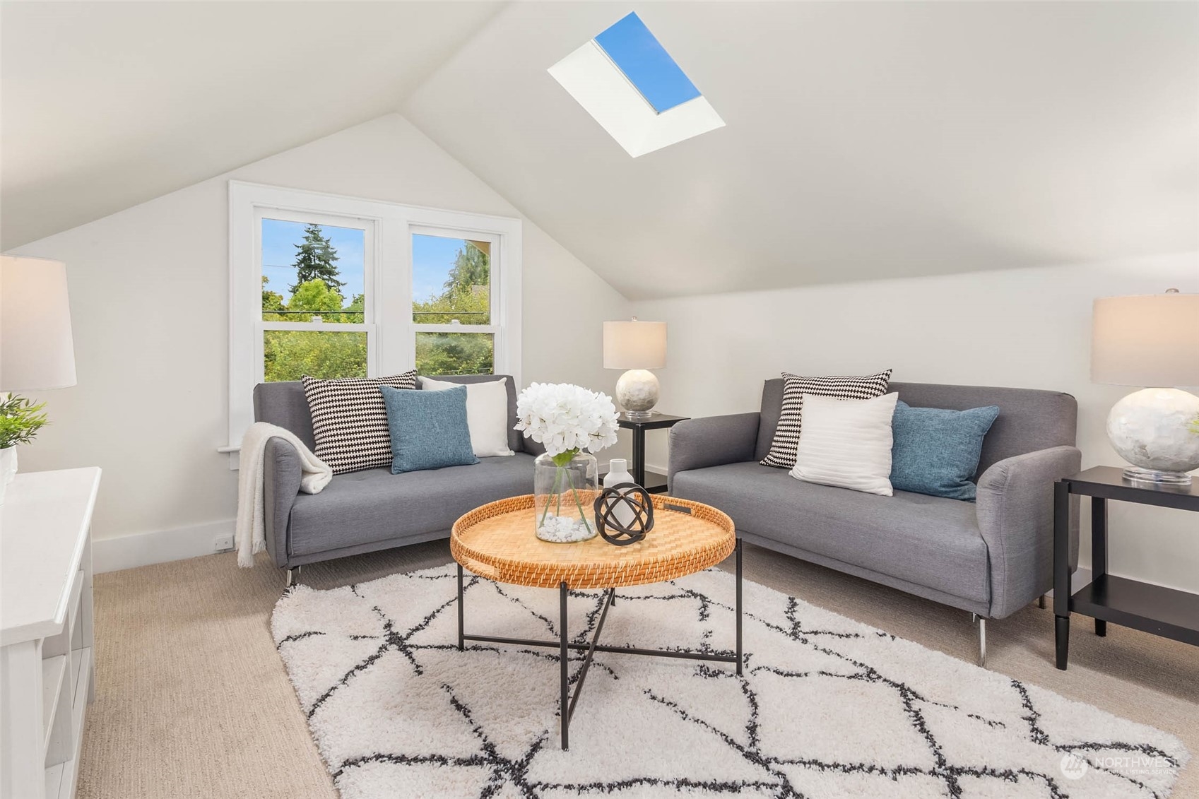 2368 North 52nd Street Seattle, WA 98103 - Photo 27 of 32 a living room with furniture a rug and a large window