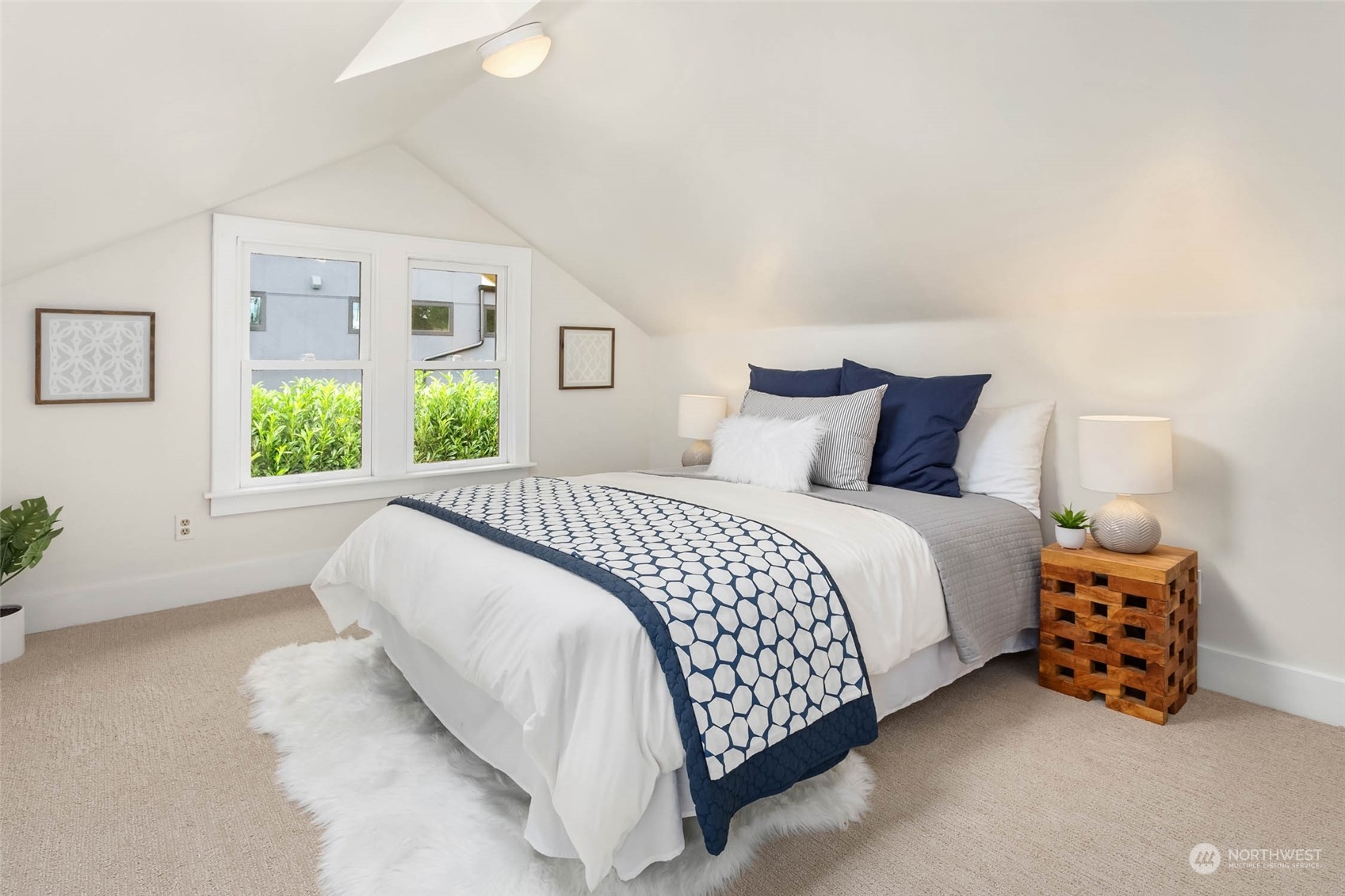 2368 North 52nd Street Seattle, WA 98103 - Photo 28 of 32 a bedroom with a bed and a couch