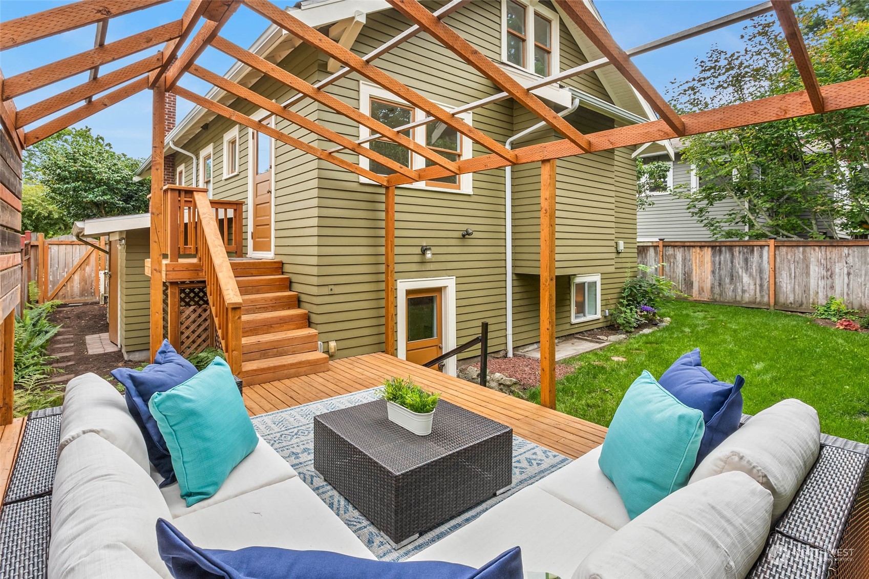 2368 North 52nd Street Seattle, WA 98103 - Photo 31 of 32 a view of a patio with couches chairs and a fire pit