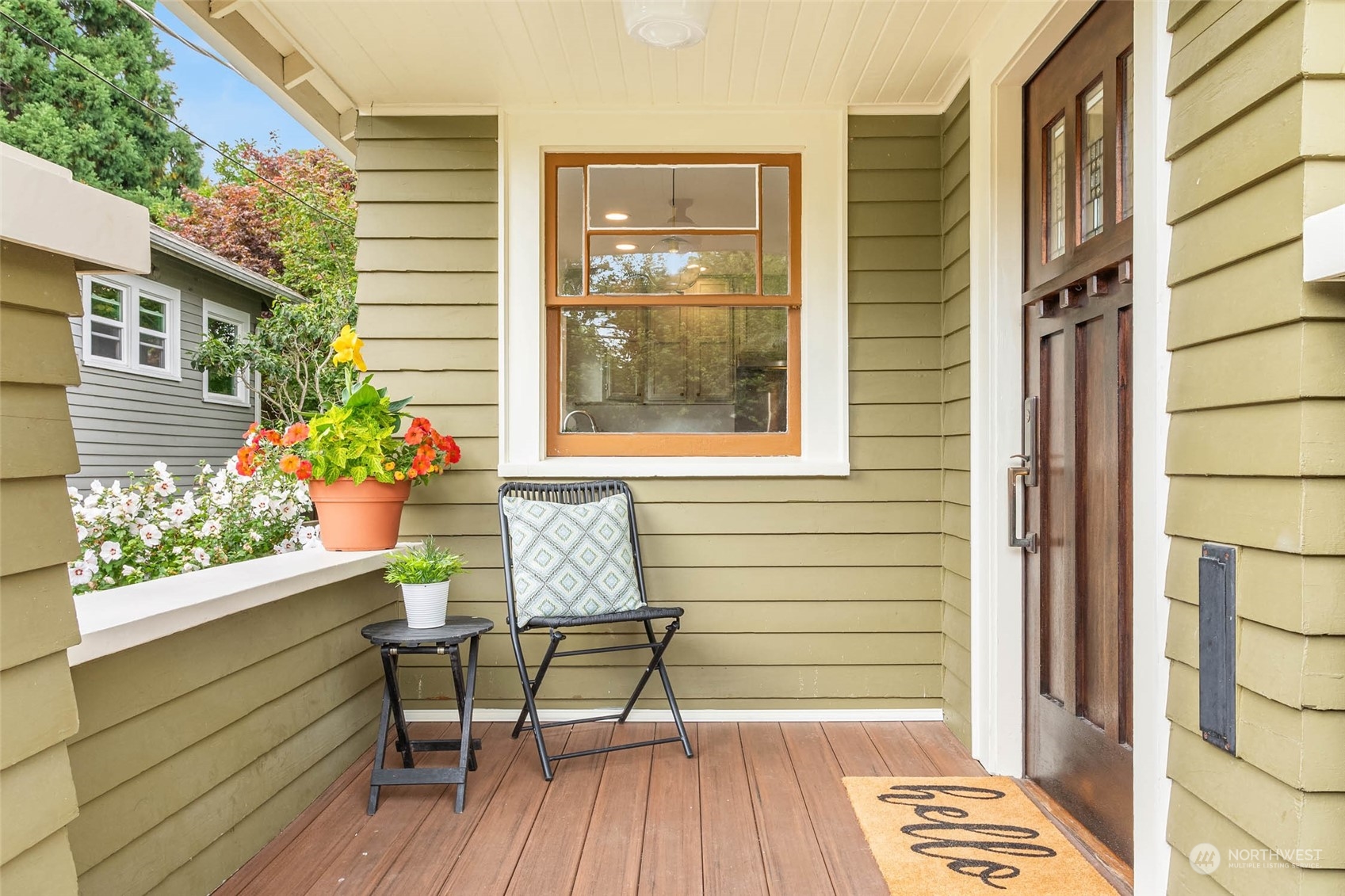 2368 North 52nd Street Seattle, WA 98103 - Photo 5 of 32 a balcony with table and chairs and potted plants