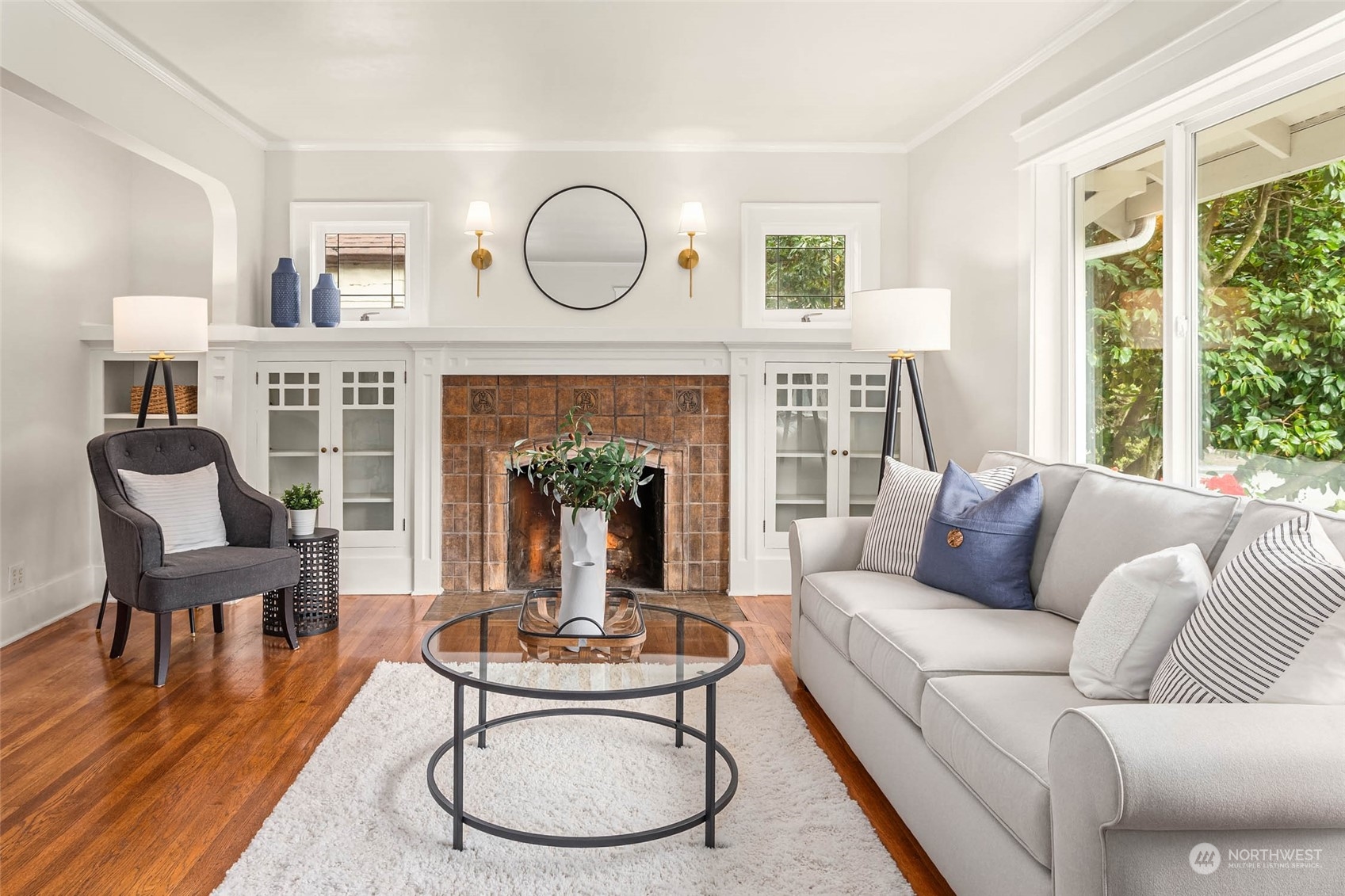 2368 North 52nd Street Seattle, WA 98103 - Photo 7 of 32 a living room with furniture a fireplace and a large window