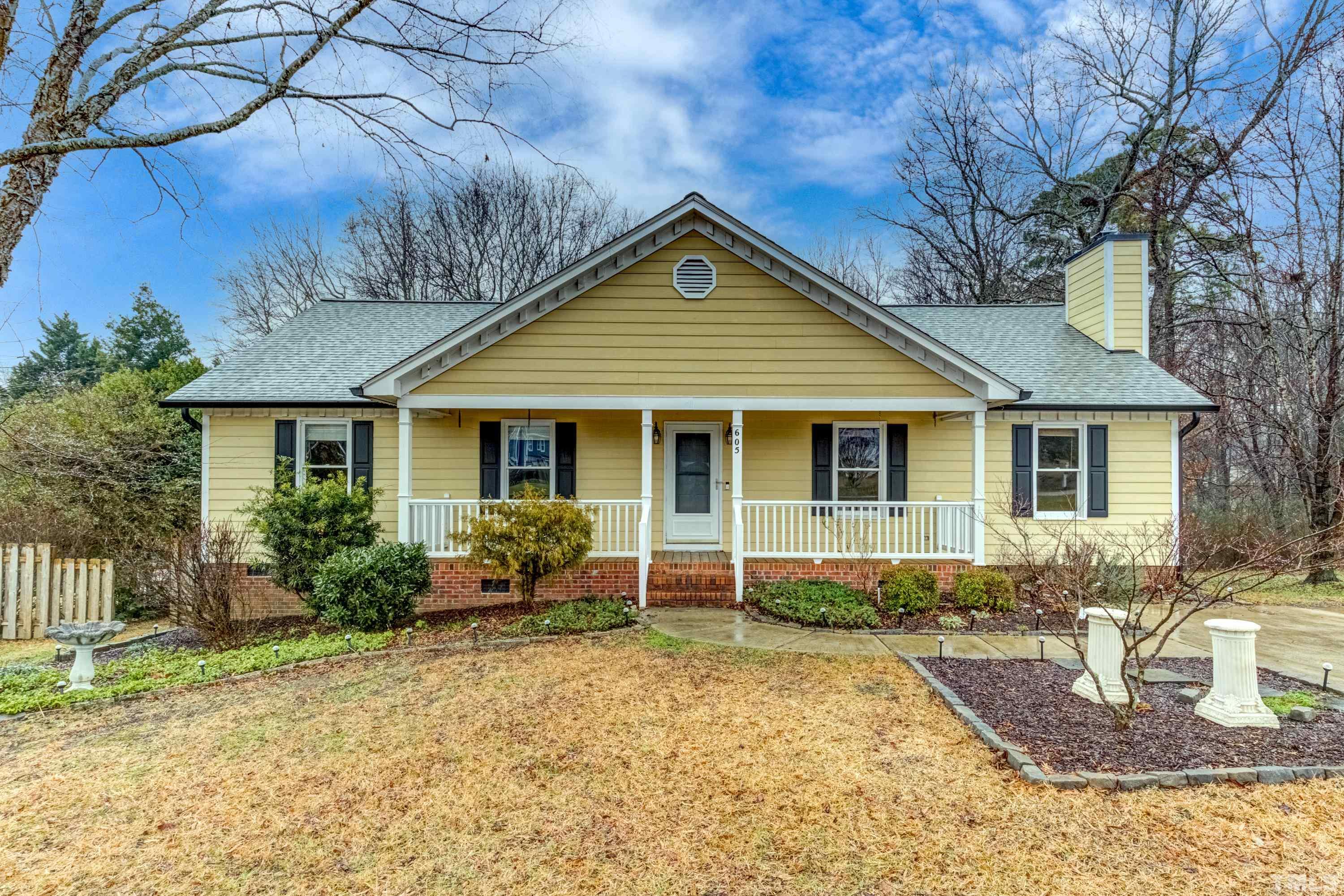 605 Jordan Ridge Lane Raleigh, NC 27603 - Photo 1 of 36 a front view of a house with garden