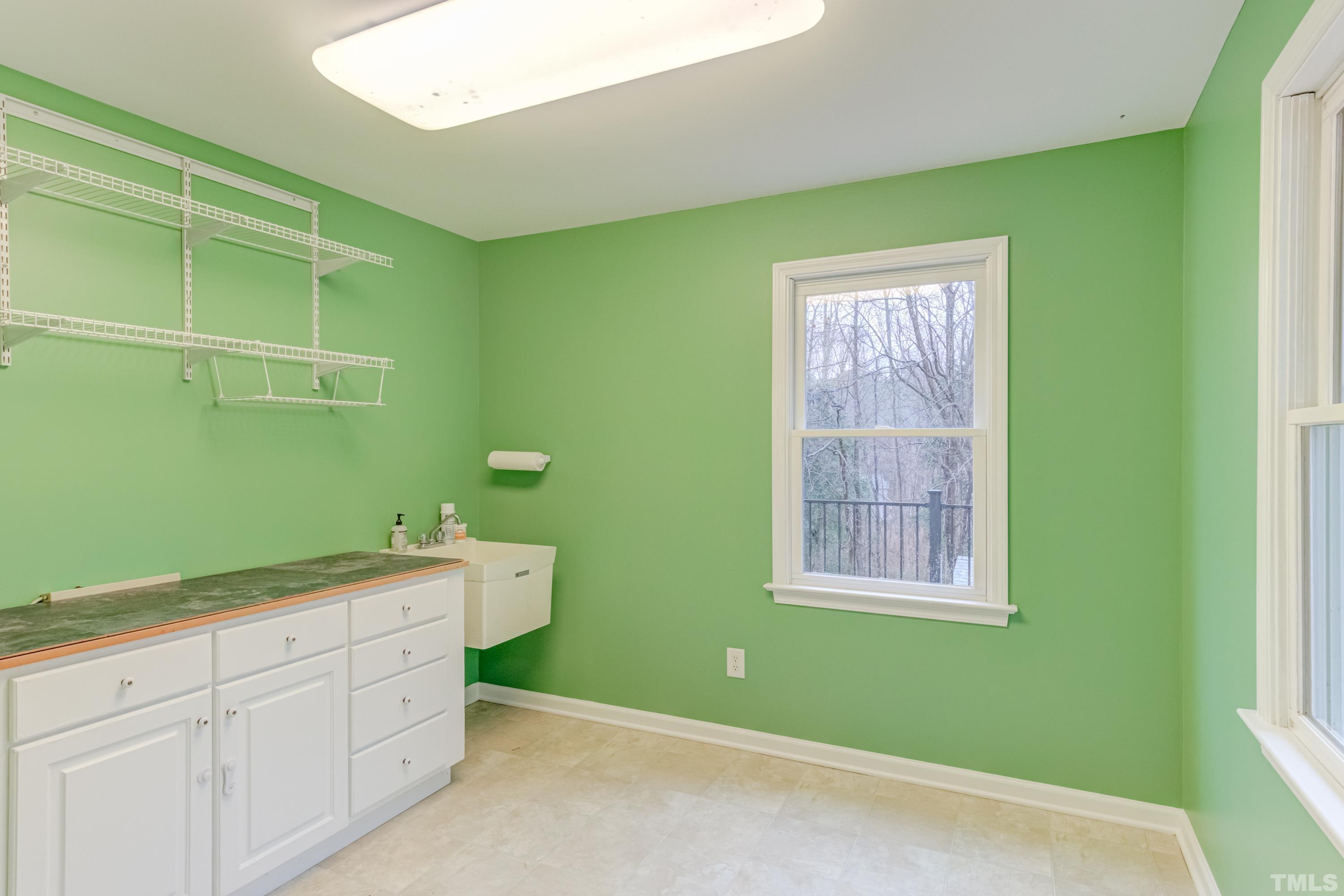 605 Jordan Ridge Lane Raleigh, NC 27603 - Photo 16 of 36 a room with two cabinet and a window