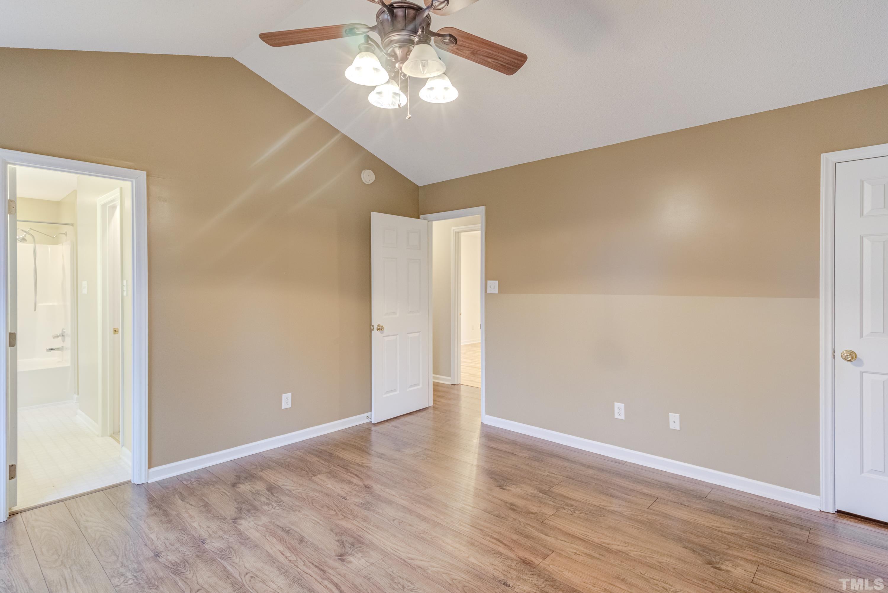 605 Jordan Ridge Lane Raleigh, NC 27603 - Photo 18 of 36 an empty room with wooden floor closet and windows