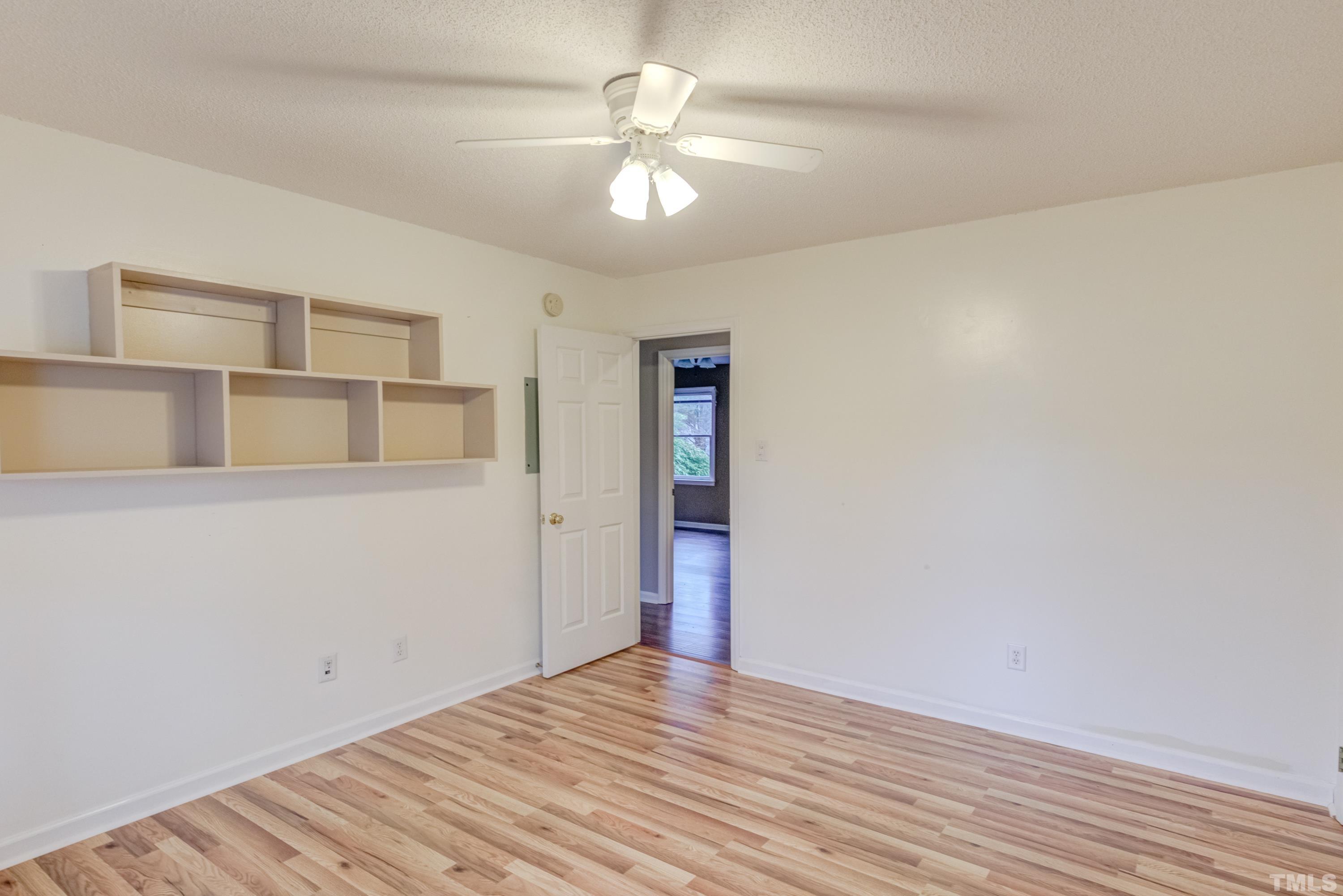 605 Jordan Ridge Lane Raleigh, NC 27603 - Photo 22 of 36 a view of an empty room with wooden floor