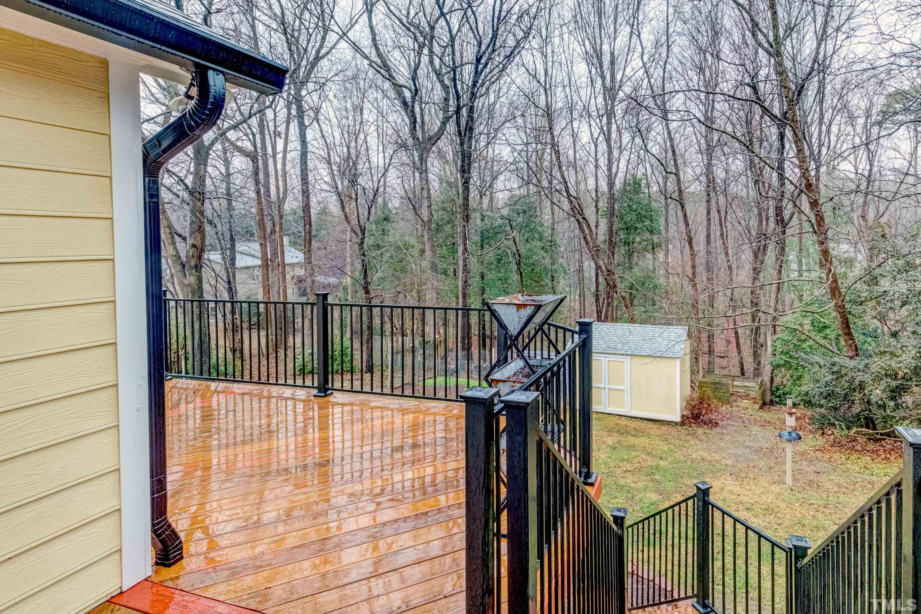 605 Jordan Ridge Lane Raleigh, NC 27603 - Photo 27 of 36 a view of a balcony with wooden floor and fence