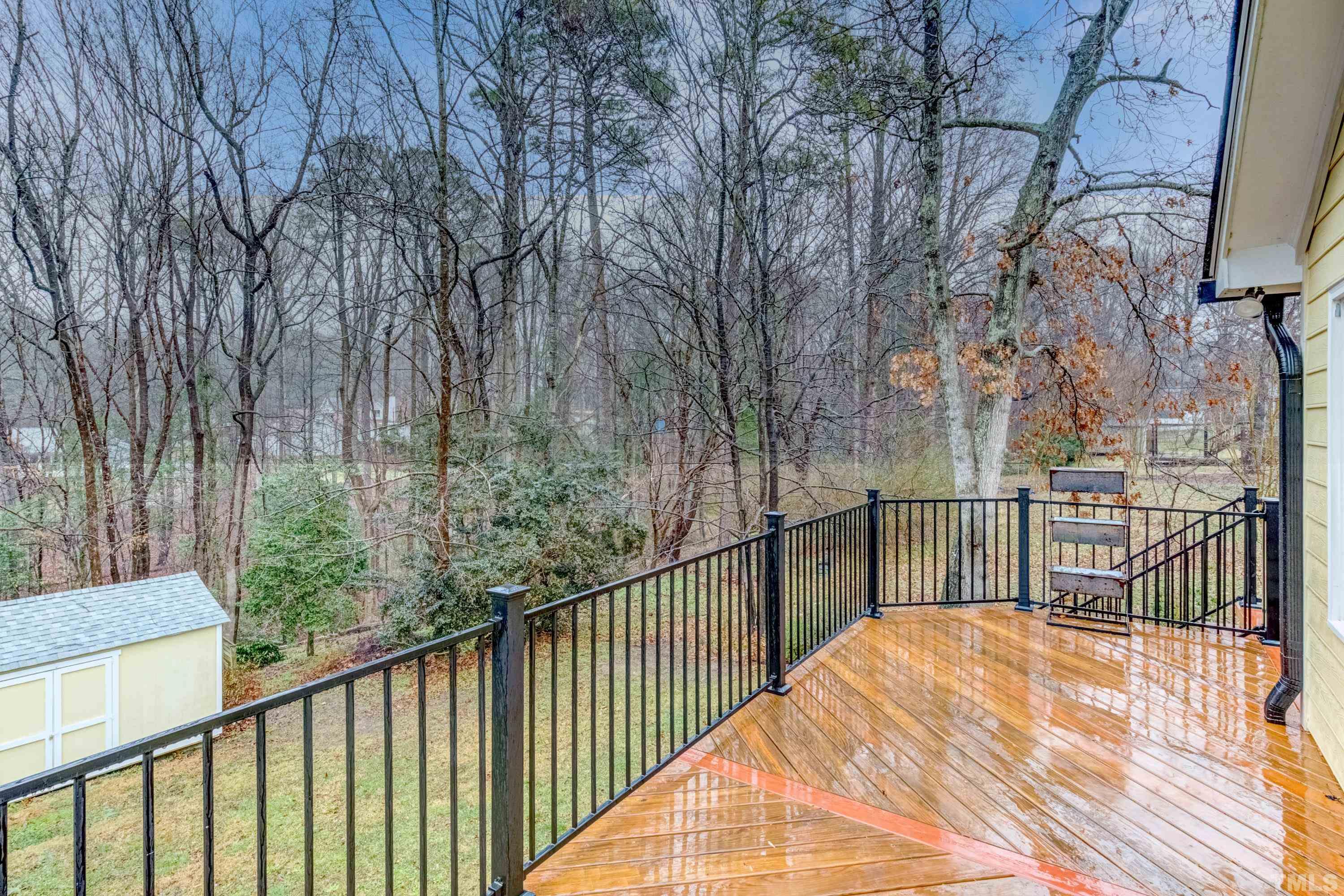 605 Jordan Ridge Lane Raleigh, NC 27603 - Photo 29 of 36 a view of a balcony with wooden floor and fence