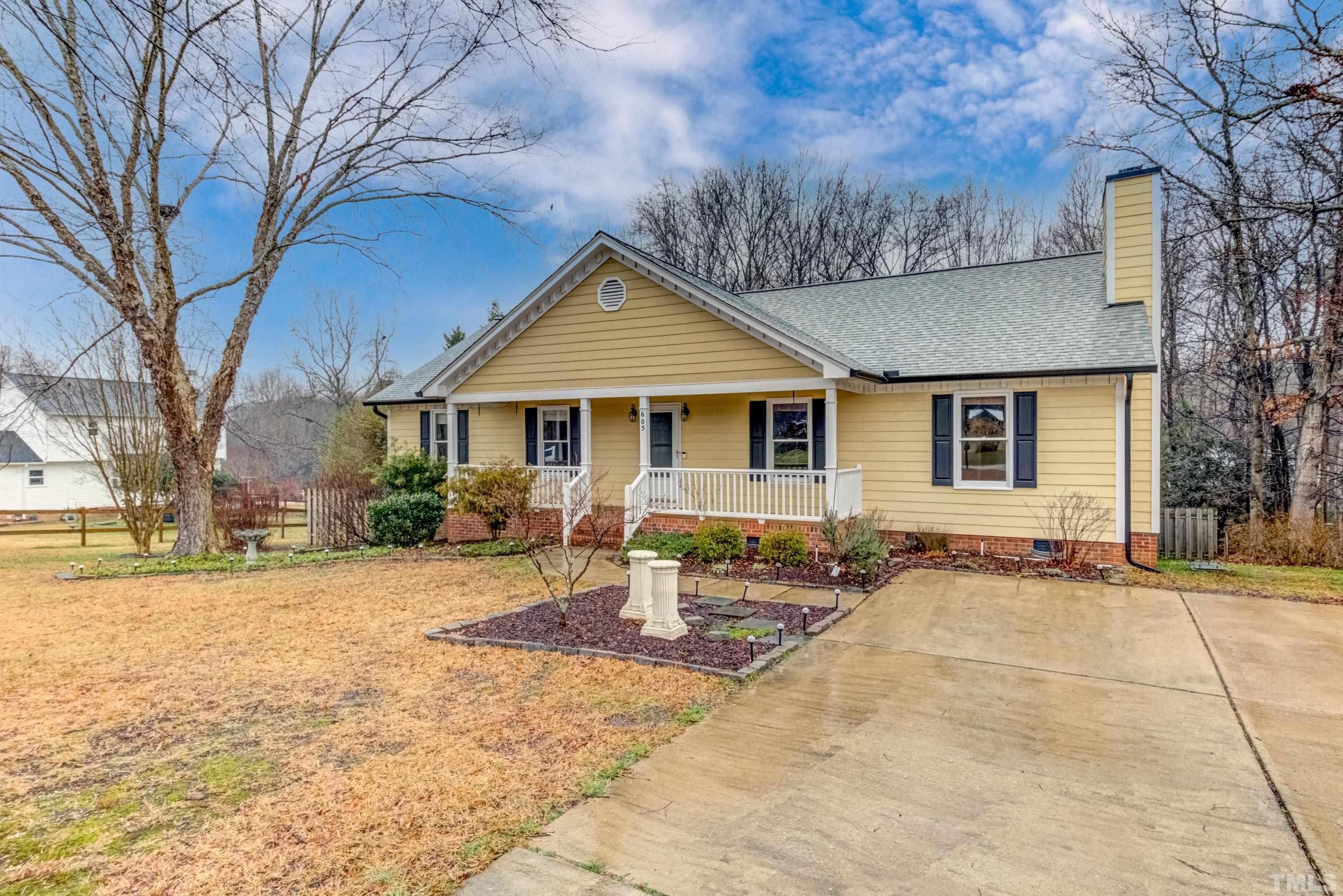 605 Jordan Ridge Lane Raleigh, NC 27603 - Photo 3 of 36 a front view of a house with a patio