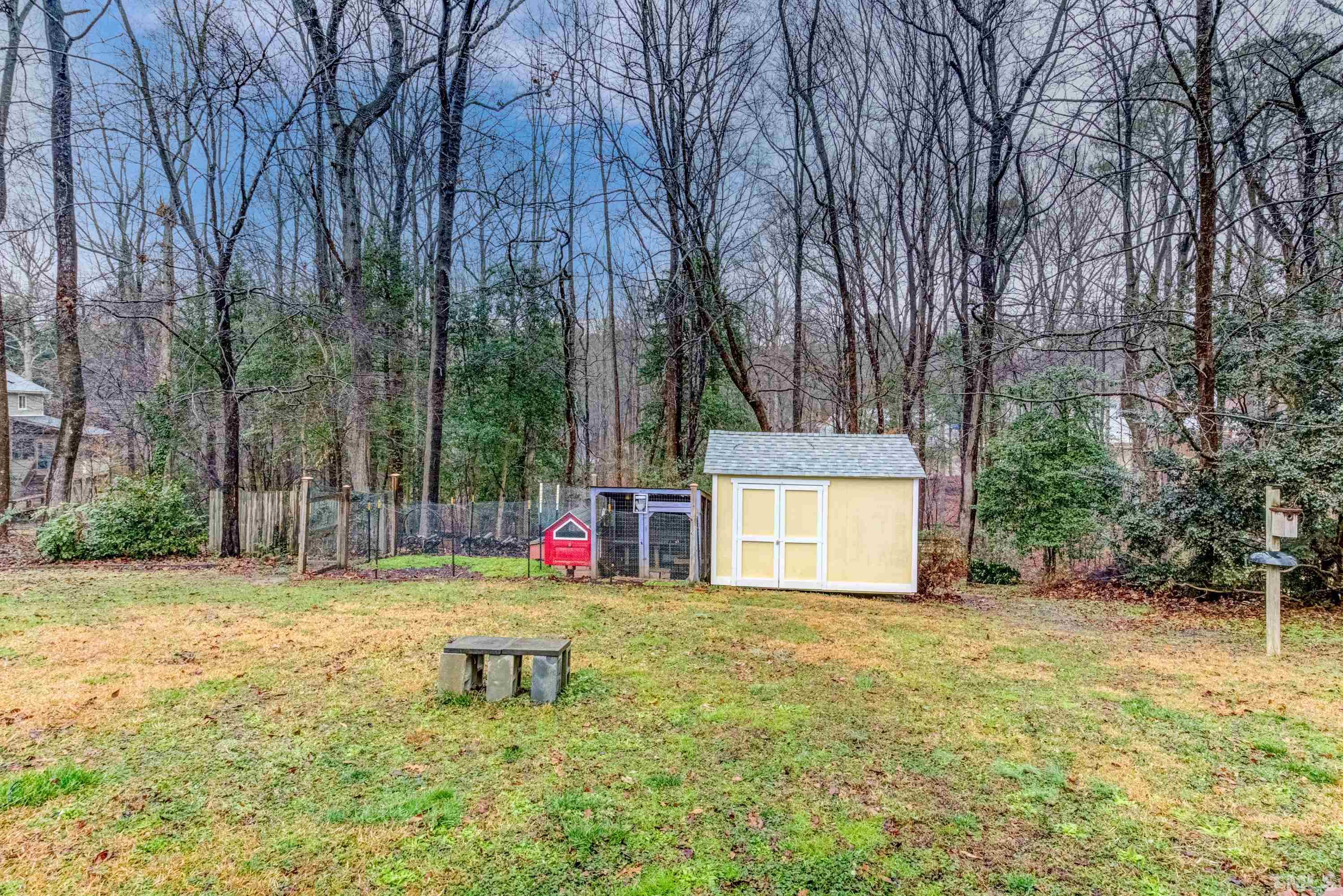 605 Jordan Ridge Lane Raleigh, NC 27603 - Photo 33 of 36 a backyard of a house with table and chairs