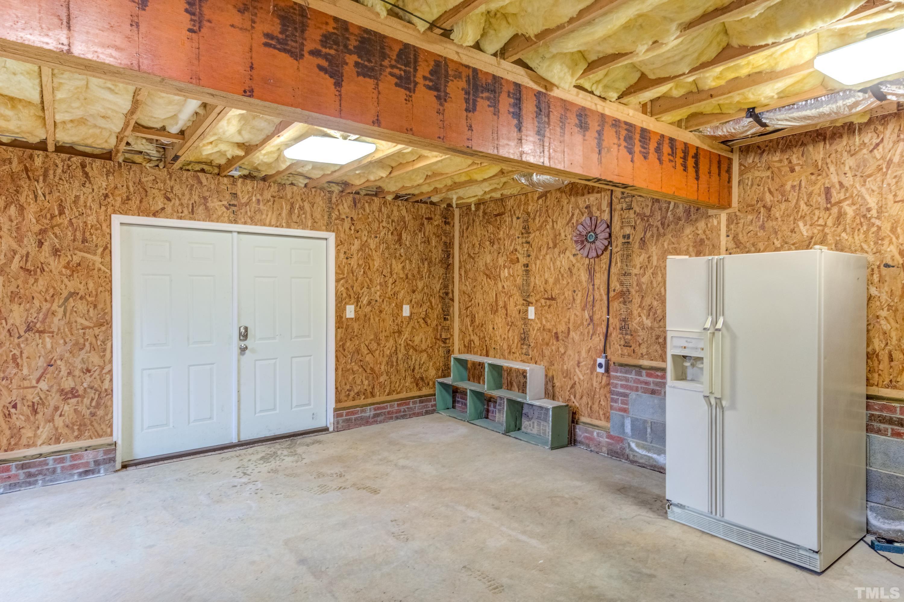605 Jordan Ridge Lane Raleigh, NC 27603 - Photo 35 of 36 a view of a room with furniture and a refrigerator