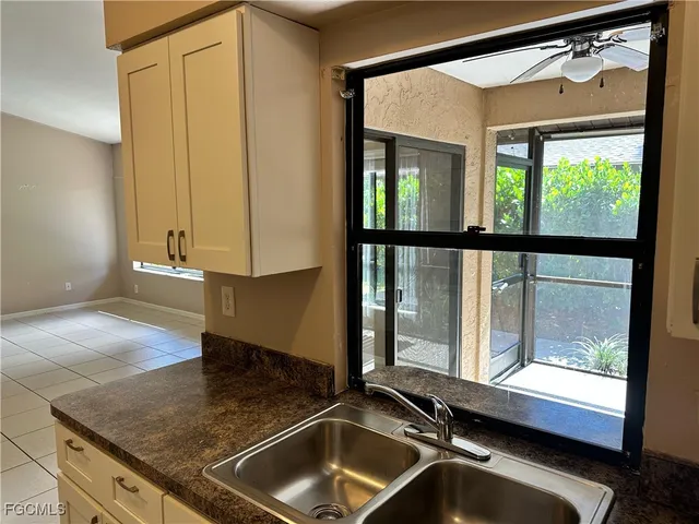 a view of a sink and a window