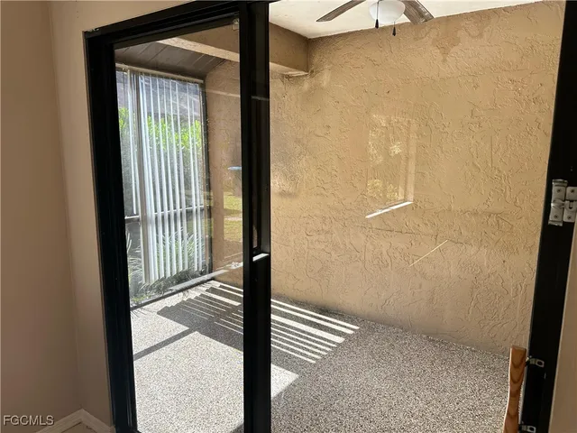 an empty room with closet and a bathroom