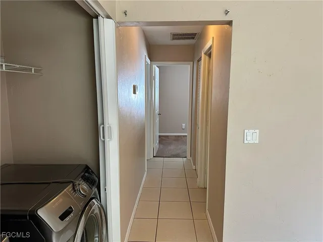 a kitchen with appliances cabinets and a counter top space