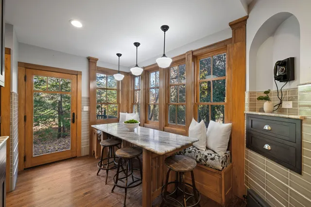 a bathroom with a sink a toilet a mirror and bathtub