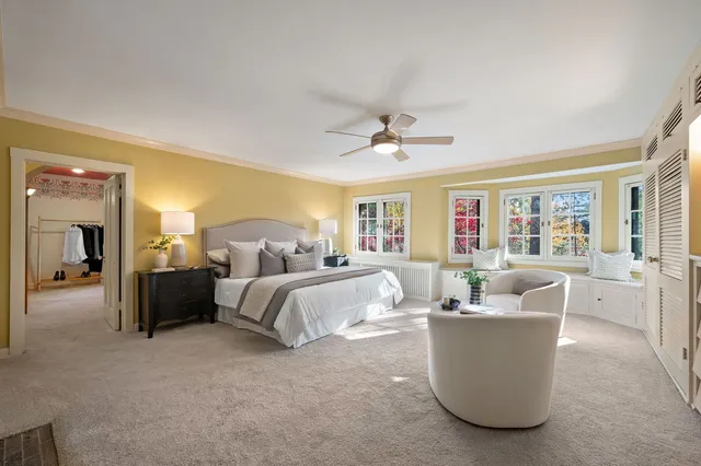 a bedroom with a large bed and a couch