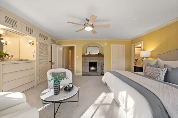 a bedroom with a large bed and a couch