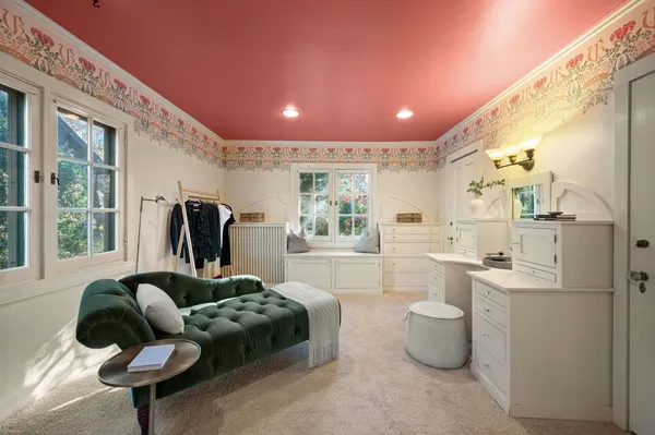 a bathroom with a bathtub and window