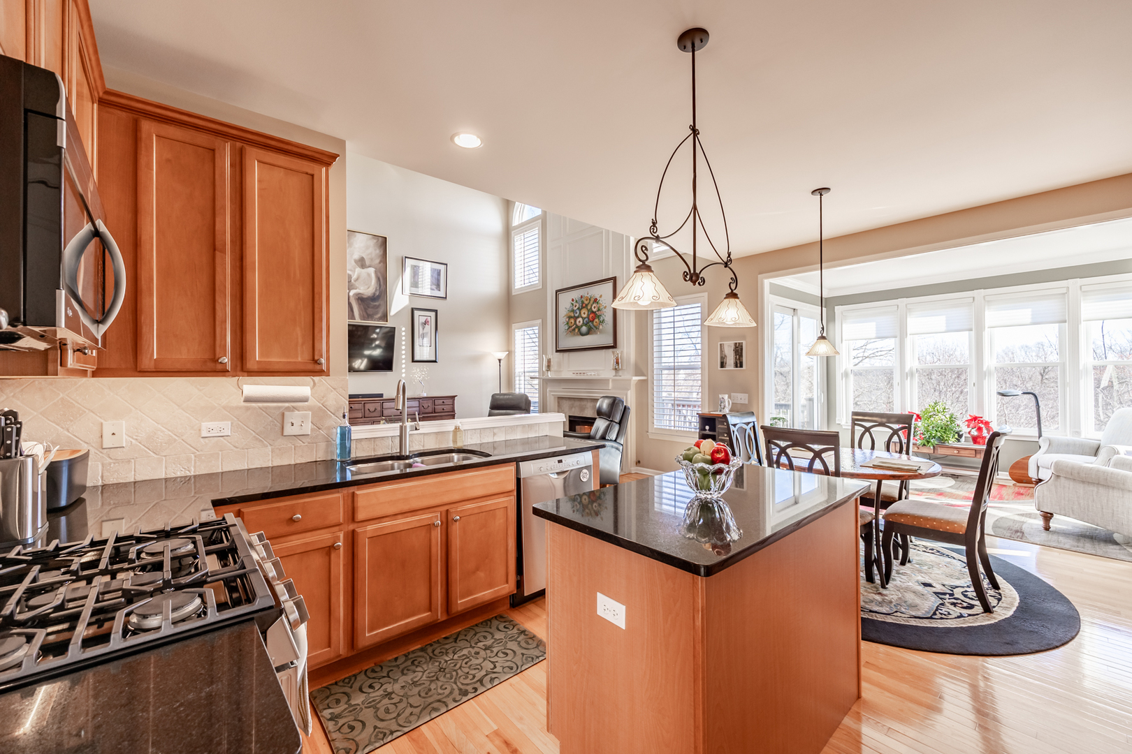 2737 Winton Court West Dundee, IL 60118 - Photo 13 of 52 a kitchen with stainless steel appliances granite countertop a sink stove and wooden cabinets